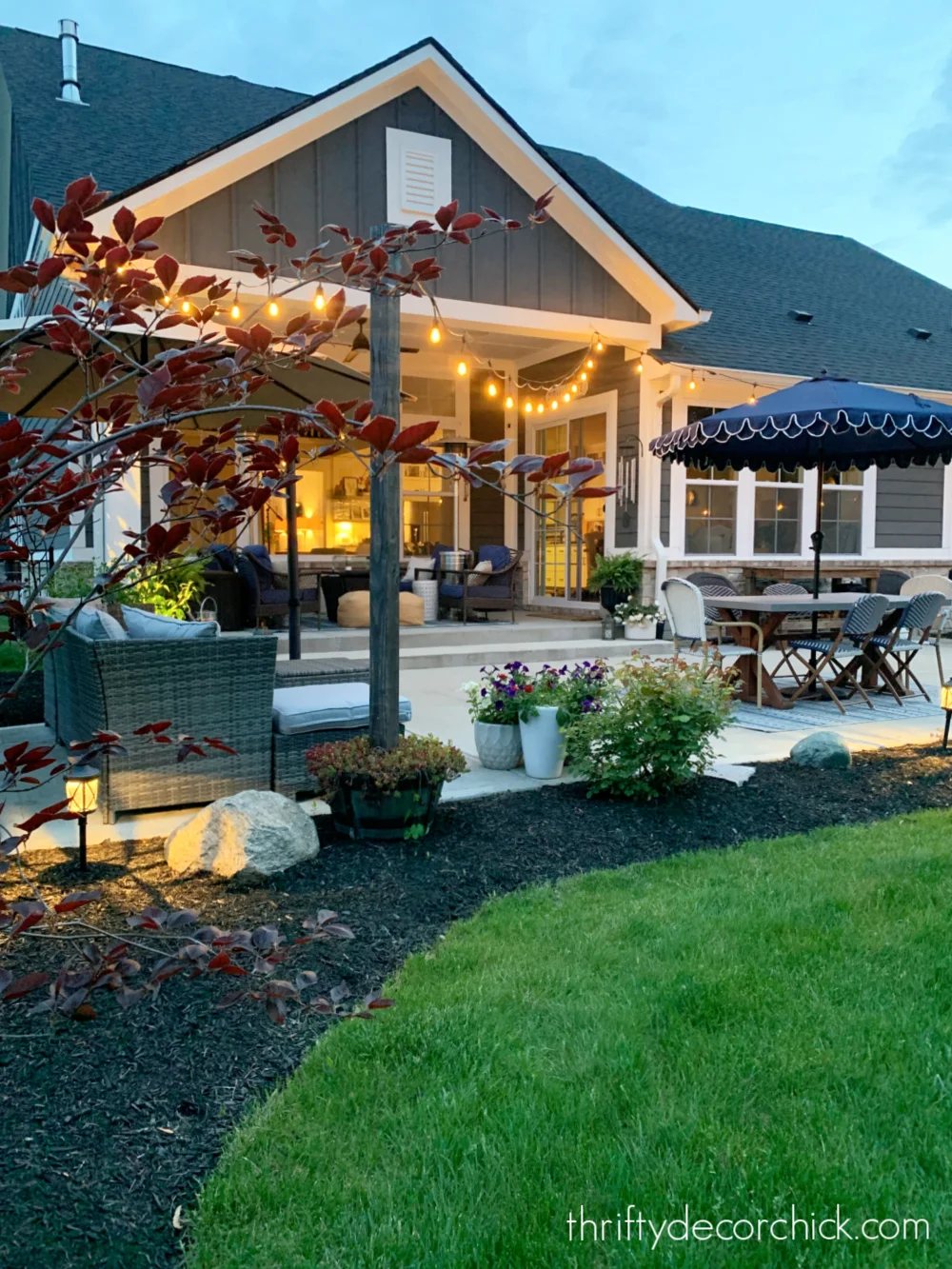 patio with string lights over table