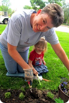 Elaine planting flowers with Ma