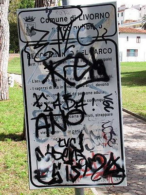 graffiti on a park sign