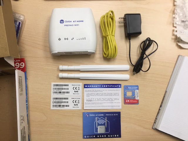 Complete Globe At Home Prepaid WiFi kit (modem, LAN cable, power adapter, two antennas, SIM card, Quick User Guide/manual, and sticker with IMEI, MAC, and S/N-serial number)