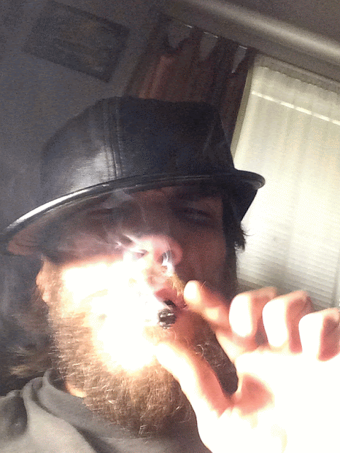 Animation of Oregonleatherboy sporting leather hat with bushed out beard blowing smoke