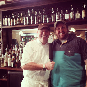 Chef Matt Murphy and Jay Ducote share a laugh with a microphone