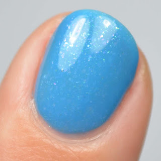 blue nail polish with flakies