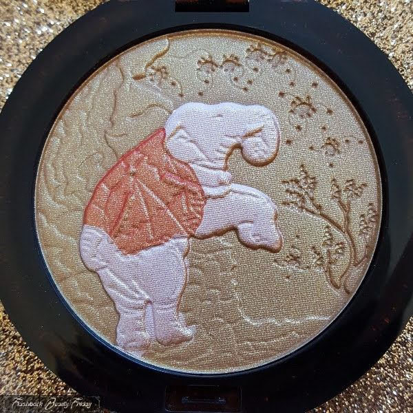 compact bronzing powder with elaborate elephant design embossed