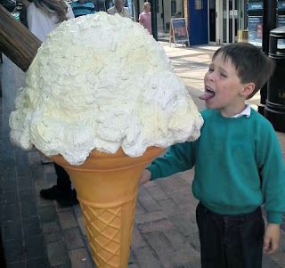 Small boy with giant ice cream