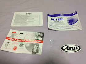 Manuals and stickers that came with the Arai RX-7 RR5