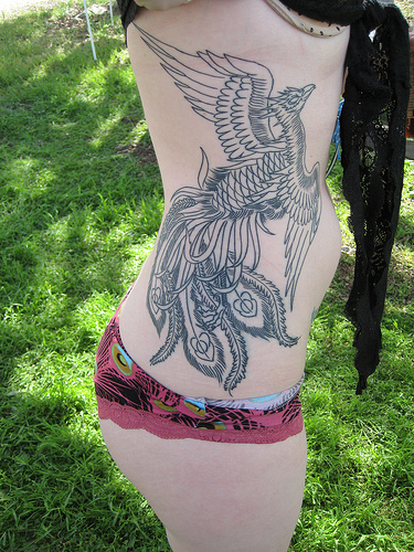 Phoenix tattoo on woman body a part waist with colour full constitute best 