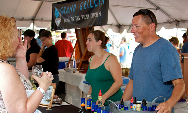 Taste of Downtown in Lansing, Michigan. Volunteers serve wine samples.