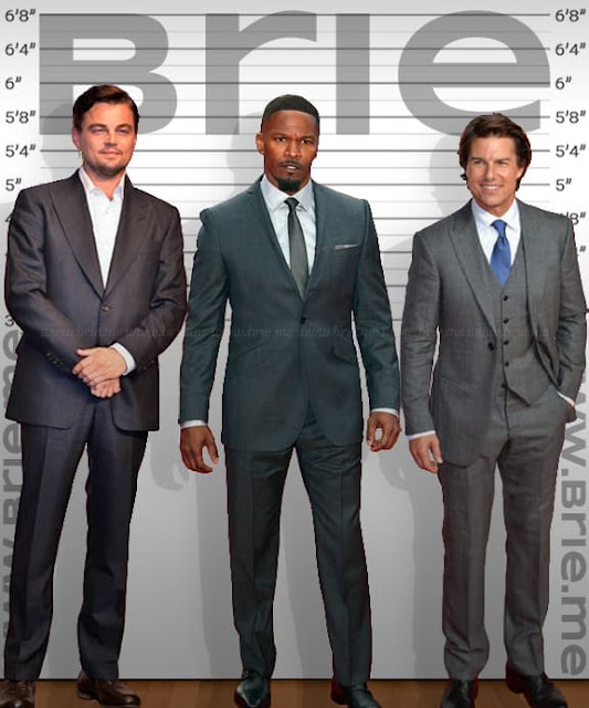 Jamie Foxx standing with Leonardo DiCaprio and Tom Cruise