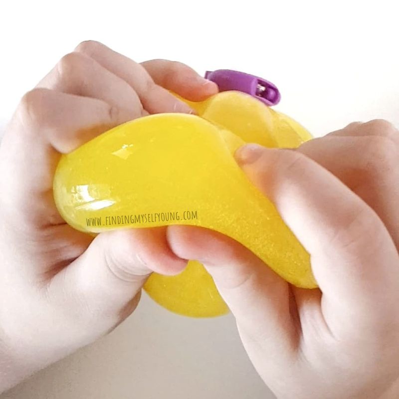 child squeezing dr squish squishy