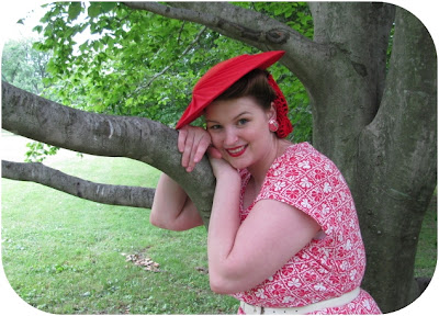 1950s plus size dress and red straw tilt hat via Va-Voom Vintage