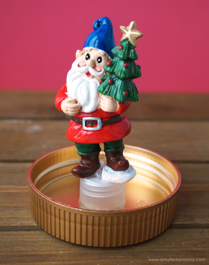 Upcycle a peanut butter jar to create your own DIY Snow Globe winter wonderland!