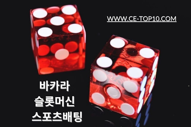 two red dice, plain black background