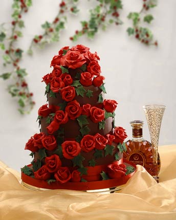 red wedding cakes with red and gold roses