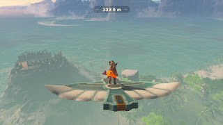 on a glider above Eventide Island, gliding towards circles in the water with a distance of 339.5 meters