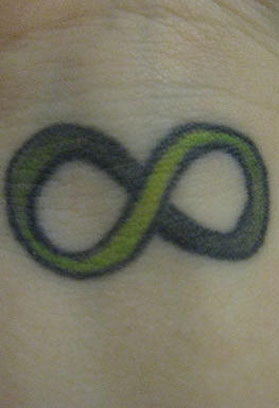 green infinity symbol wrist tattoo