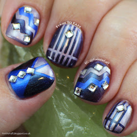 Blue and purple tape mani with rhinestone accents.