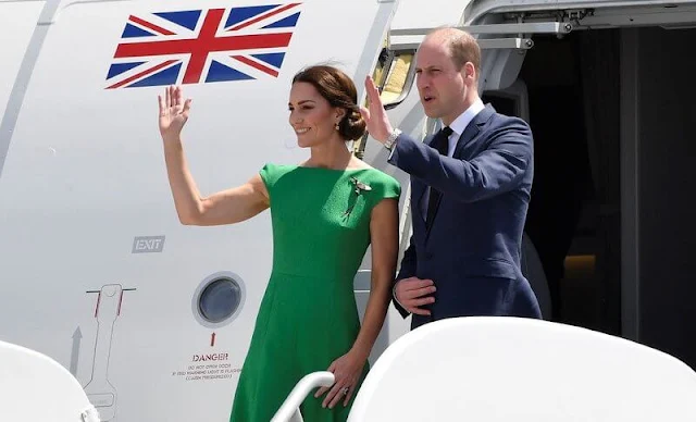 Kate Middleton wore a green Denver midi dress by Emilia Wickstead. Queen's Hummingbird Brooch. Kiki McDonough citrine earrings