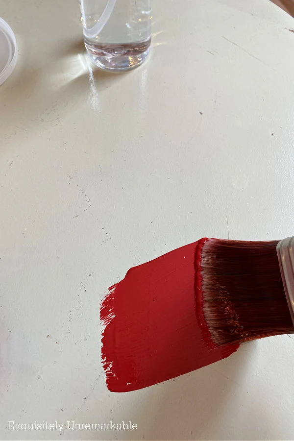 Red paint on white table