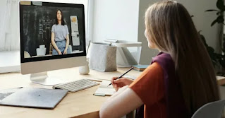 "Student attending an online class from home, showcasing the flexibility and adaptability of distance learning compared to traditional classroom education."