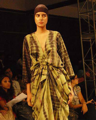 A model displays a creation by designer Kallol Datta during the Day 2 of 'Kolkata Fashion week II' on September 10, 2009.