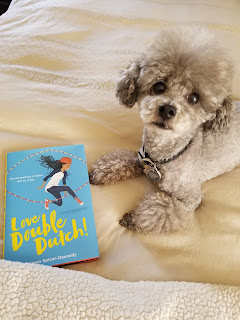 Tiger, the author's dog, with the book Love Double Dutch! ~ Doreen Spicer-Dannelly's Operation Awesome Debut Author Spotlight and Emerging First Book