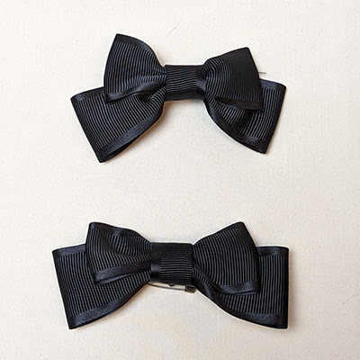 Black grosgrain ribbon bows