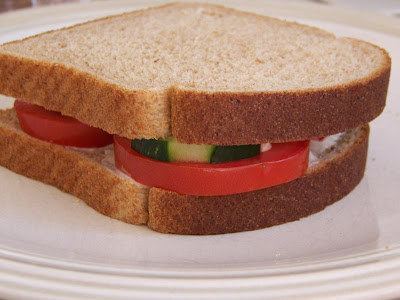 tomato and cucumber sandwich with garlic chive spread