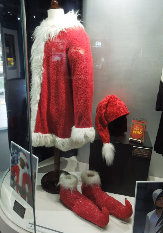 The Grinch Santa suit and The Book of Who prop