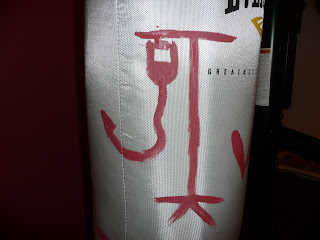 Drawings on an 80-pound heavy punching bag