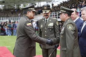 Colombia's outgoing police chief Rodolfo Palomino watches his successor being sworn in ...