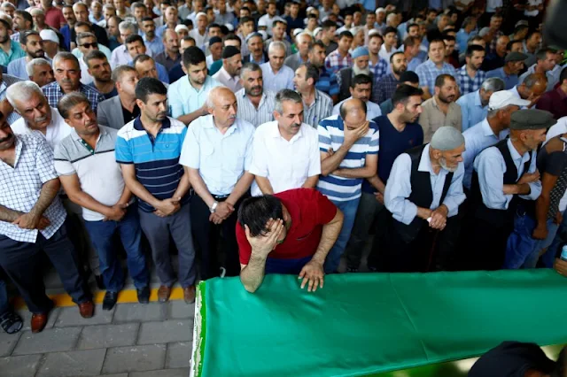 Image Attribute: A family member of a victim of a suicide bombing at a wedding celebration mourns over his coffin during a funeral ceremony in the southern Turkish city of Gaziantep, Turkey, August 21, 2016. REUTERS/Osman Orsal/File Photo