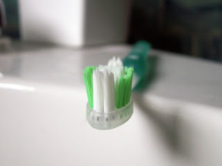 Image of a Tooth brush on a sink: this article is about How To Protect Your Teeth From Competitive Swimming