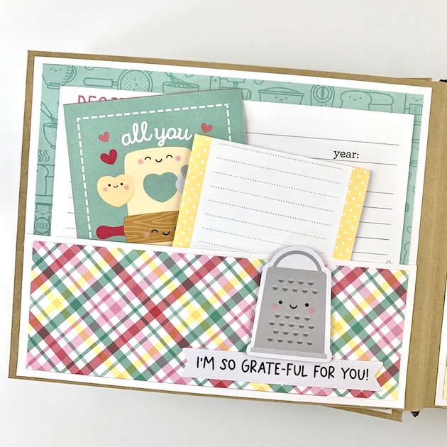 Baking scrapbook album page with a pocket and journaling cards