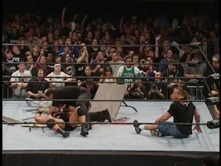 ECW One Night Stand 2005 - Rob Van Dam looks confused as Rhyno gores himself through a table