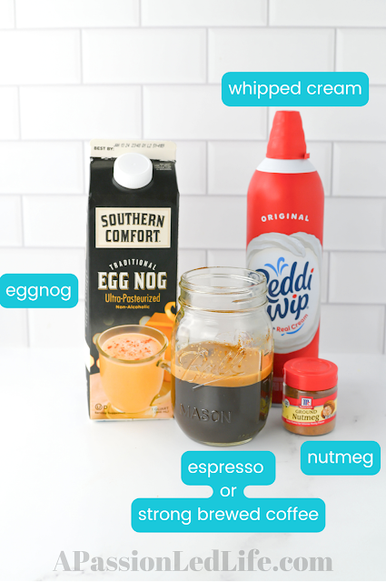 containers of eggnog, nutmeg, whipped cream, and coffee