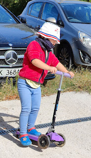 Rosie playing on her scooter