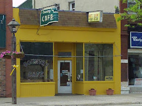 new yellow paint on Country Cafe and Dar's Hair Salon in Madison  SD