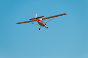Belite ultralight airplane: UltraCub passes overhead. (turtledeck flying away)