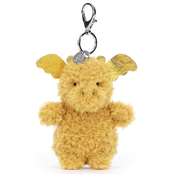 This is the Jellycat Little Dragon Bag Charm, coming with fluffy saffron fur, metallic gold horns, tiny stitched nostrils and a metallic key clasp with a Jellycat embossed disc.