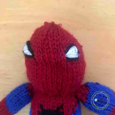 Picture of knitted spidermans head once its been stitched up
