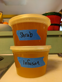 Two plastic containers, one labeled "Shrub," the other "Infusion"