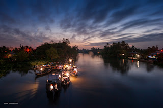 Sunrise with the floating market in Can Tho