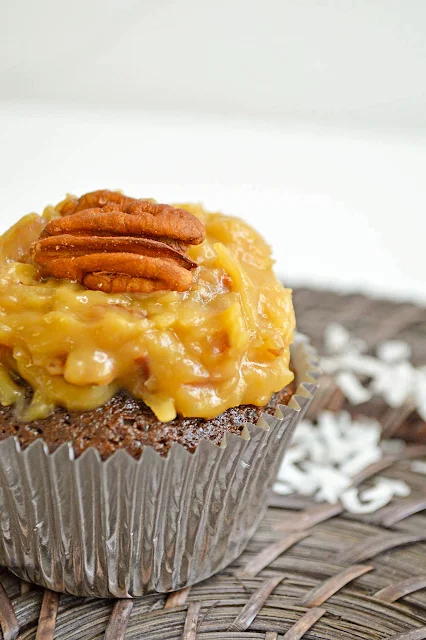 The cupcake is made with Baker's German Sweet Chocolate Bar that gives the true German Chocolate flavor.  Homemade buttery pecan coconut frosting is piled on top to complete the Iconic German Chocolate Cake that is loved throughout the holidays.