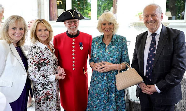 The Duchess of Cornwall wore a floral print midi dress by Fiona Clare. The lunch organized by Gyles Brandreth and the Oldie