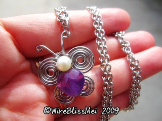 simple wire wrapped butterfly pendant with heart shaped Amethyst