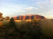 A cloud icing Uluru (Ayers Rock) (ayq)