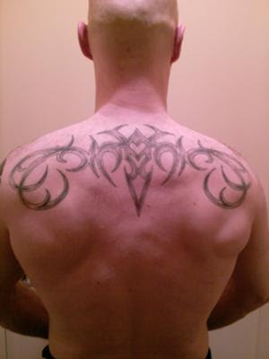 male back tattoos. tribal ack tattoo designs for
