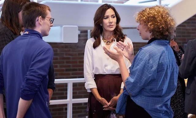 Crown Princess Mary wore a burgundy floral print midi skirt by Ted Baker, Dolce and Gabbana, Etro, and white silk blouse