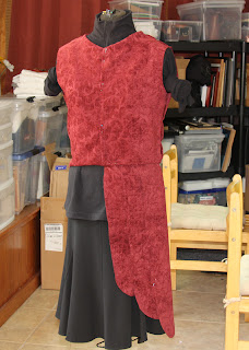 Testing the cut fabric on the dress form.